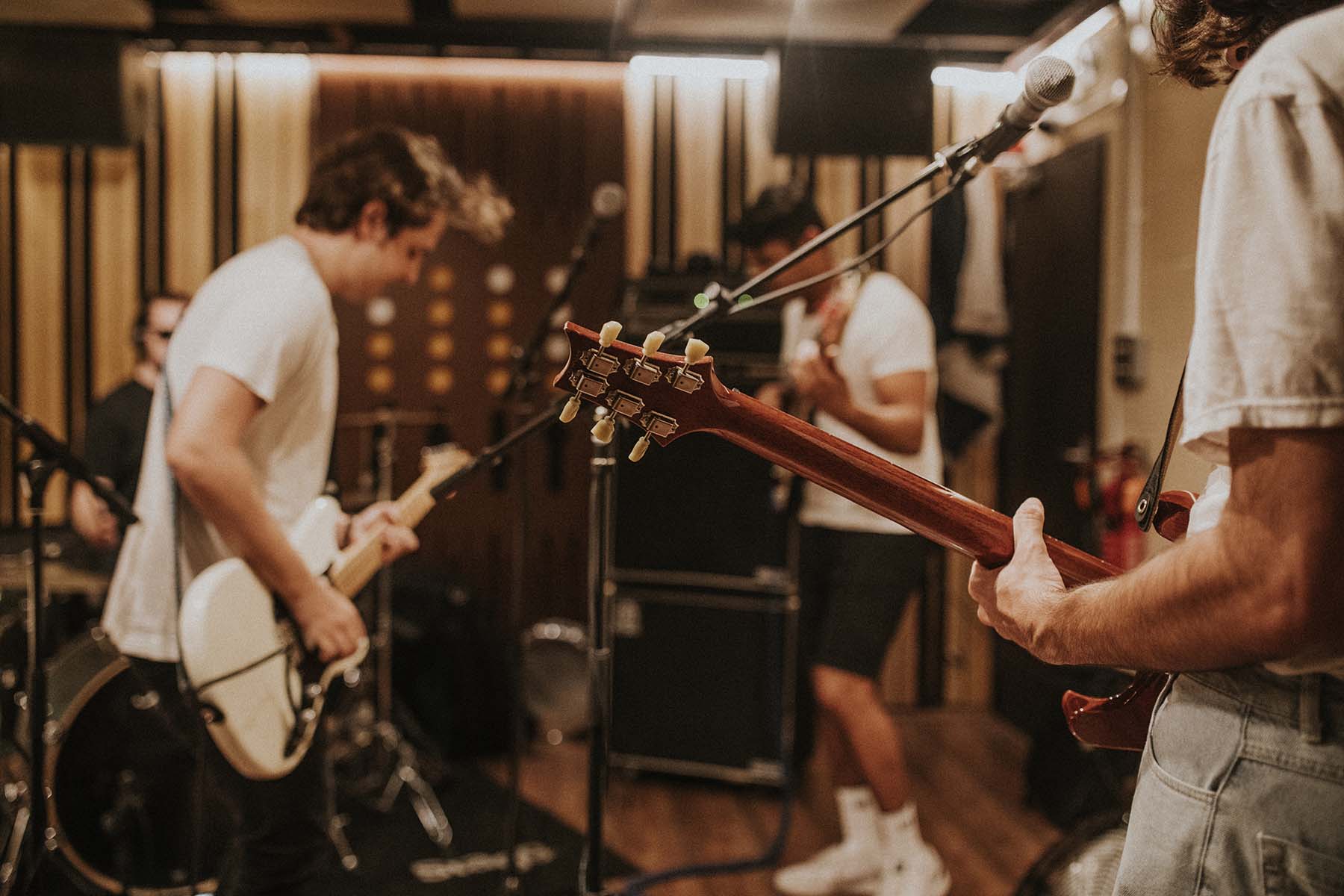 Music band guitarist performing repetition in recording studio